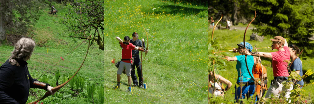 Midt i det frodige grønne område øver enkeltpersoner bueskydning, deres fokus er skarpt, når de sigter mod mål. Scenen, der minder om et fredfyldt Wagrain-landskab, fanger en blanding af koncentration og naturlig skønhed.
